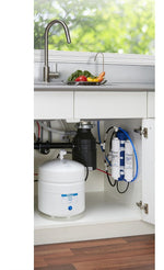 Aero-Gro American Pure Efficiency reverse osmosis system and storage tank neatly installed under a kitchen sink